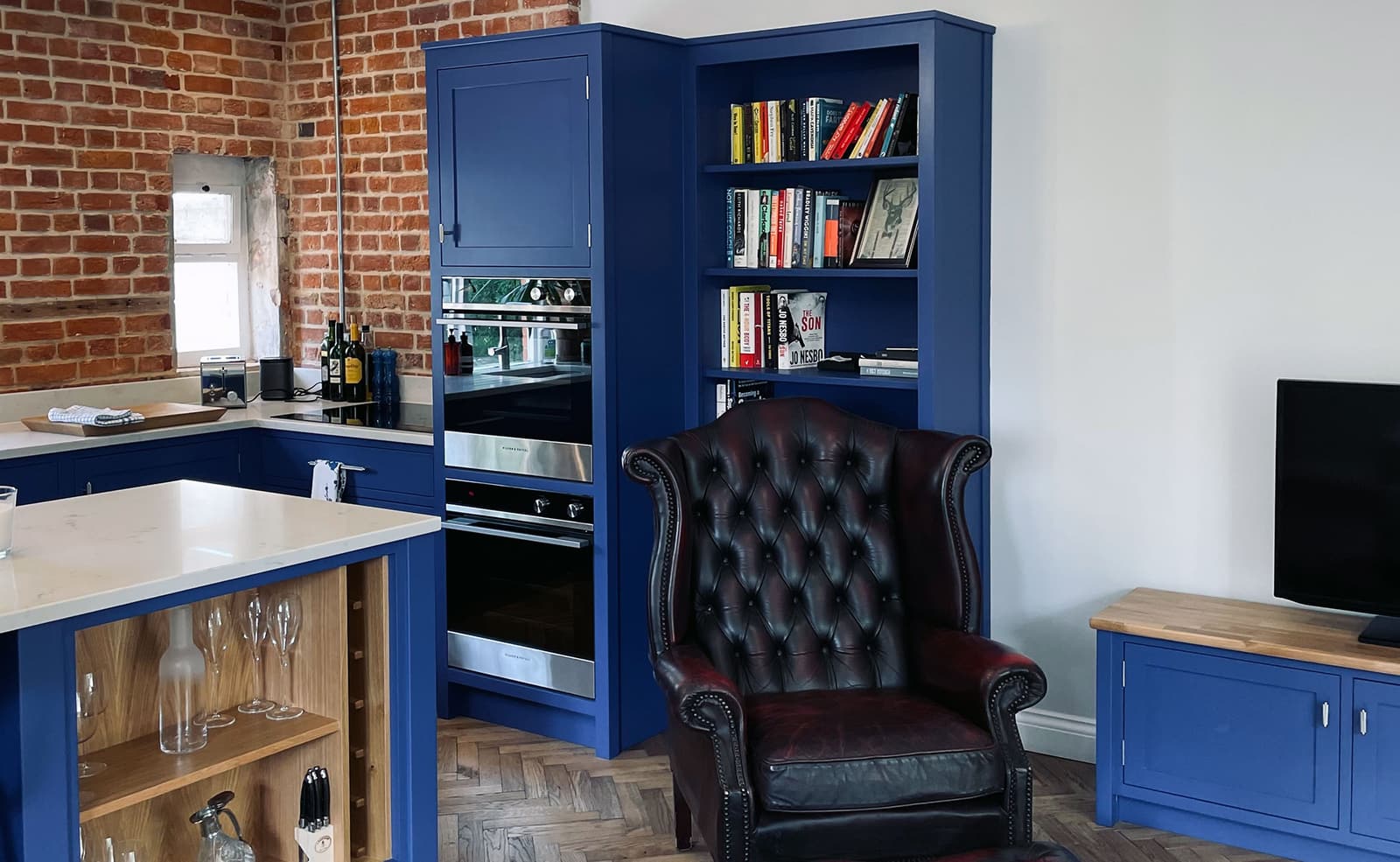 Open plan bespoke kitchen and lounge by Rao Furniture