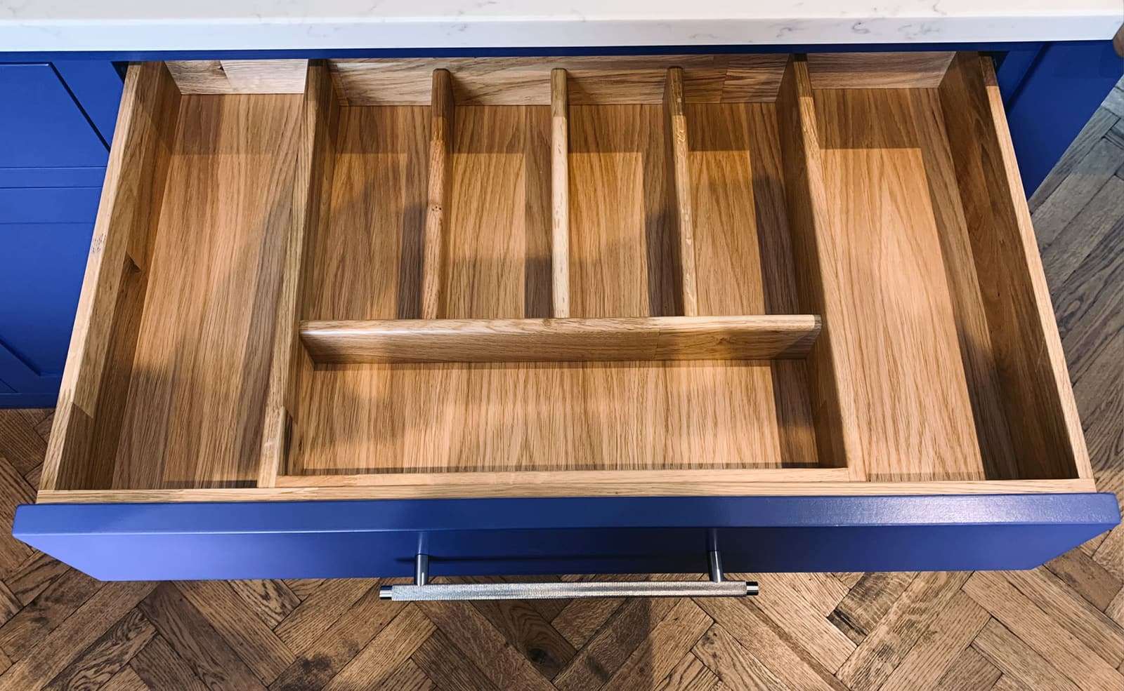 Open plan bespoke kitchen and lounge by Rao Furniture