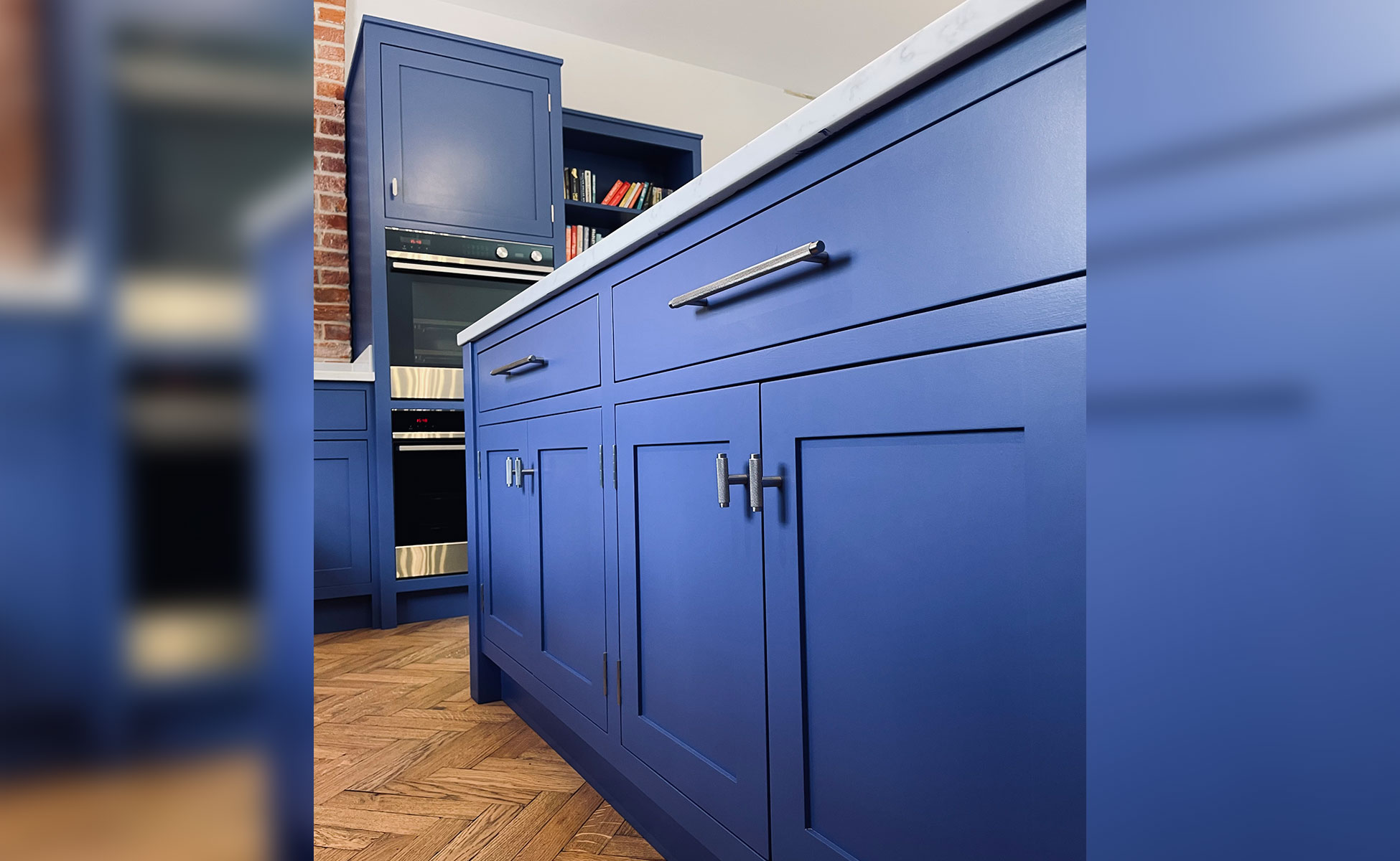 Open plan bespoke kitchen and lounge by Rao Furniture