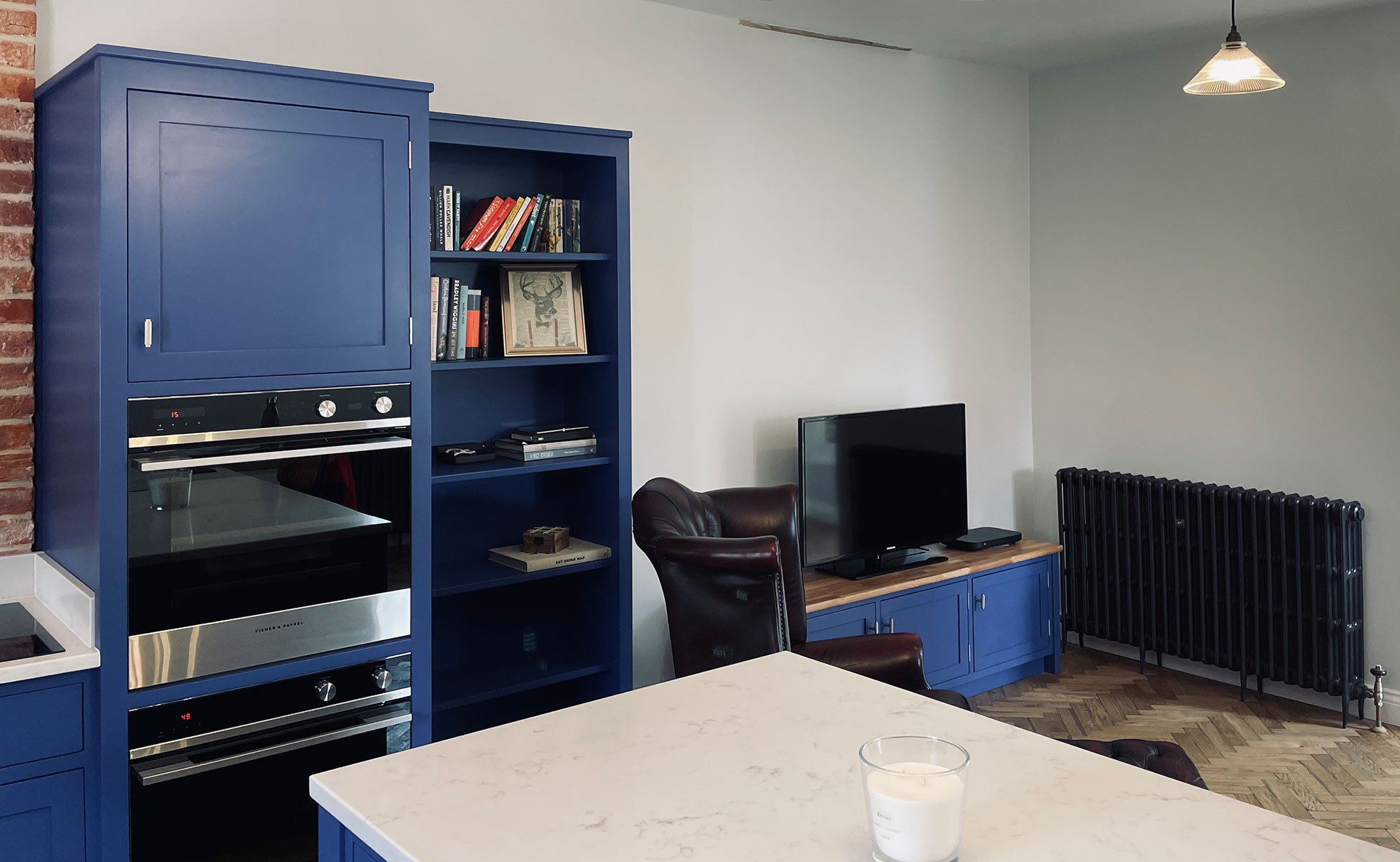 Open plan bespoke kitchen and lounge by Rao Furniture