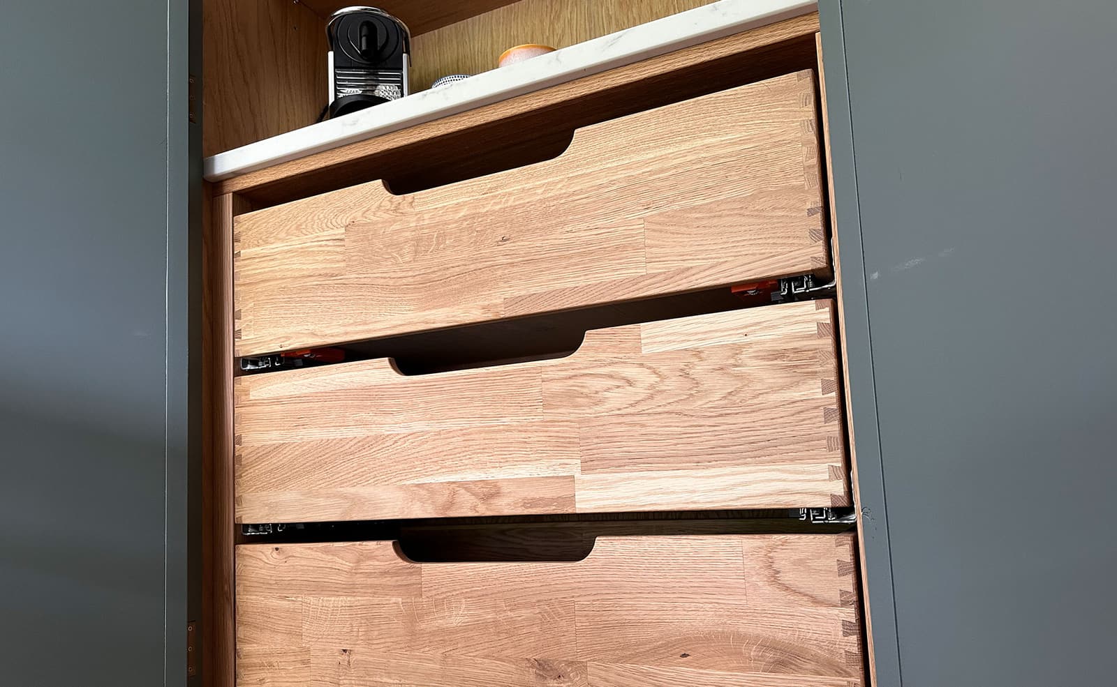 Open plan bespoke slim line kitchen by Rao Furniture